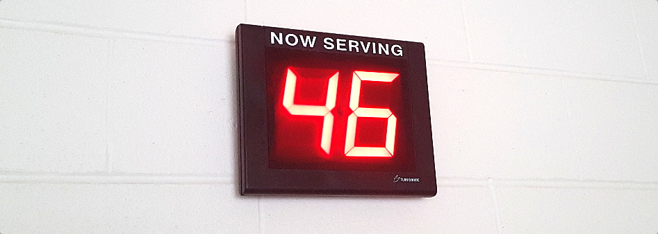 digital now serving sign showing number 46