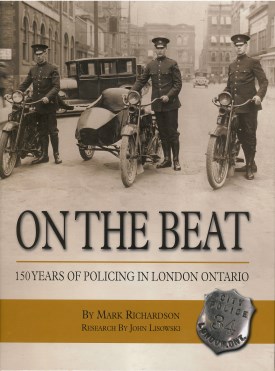 Photo of 3 Police Officers and Motorcycles with text "On the Beat 150 Years of Policing in London Ontario"
