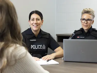 Two female officers interviewing applicant
