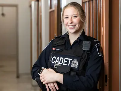 Female Cadet standing in front of LPS jail cell